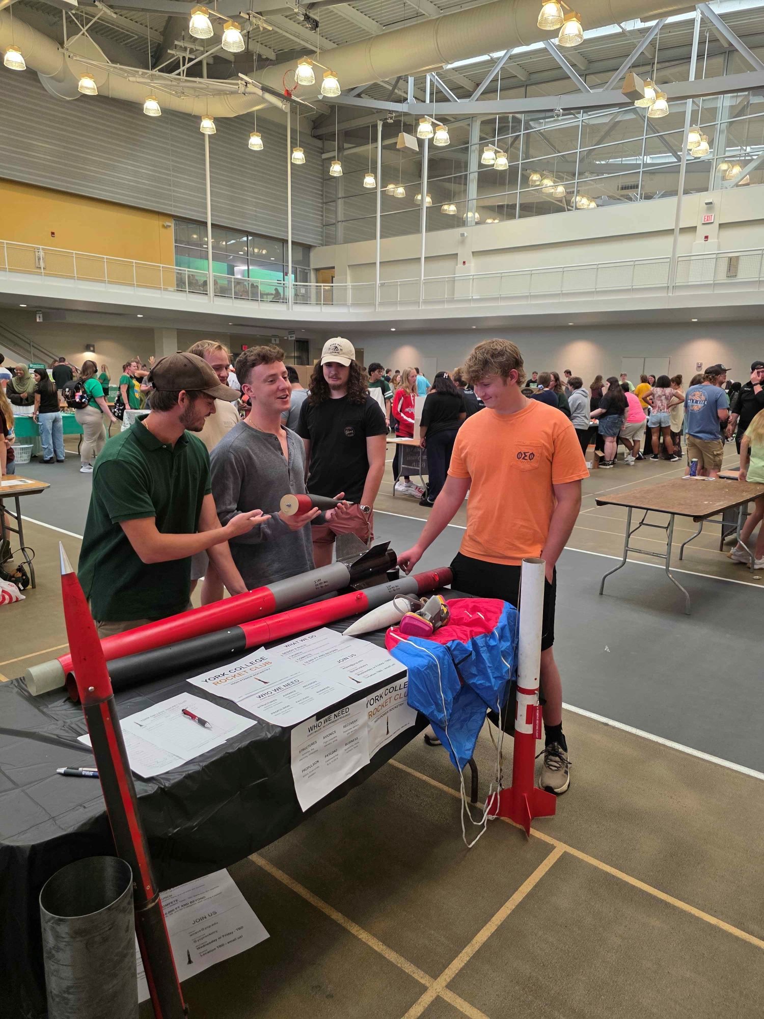 Club members showing their rockets to students at the York College club fair